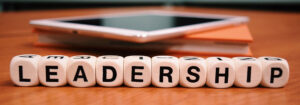 Terninger danner ordet "leadership"